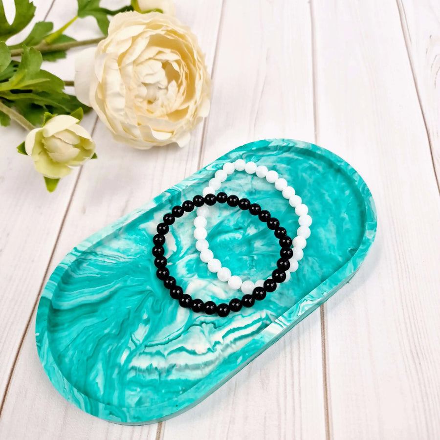 decorative oval resin tray in green and white that is made from diy resin casting kit